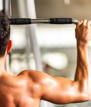 strong man exercising in the sport gym, workout exercise training in fitness for body strong